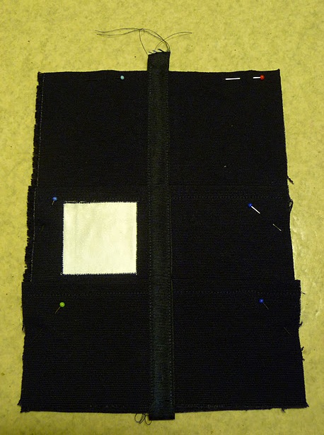 Front part with pockets and sign sewn